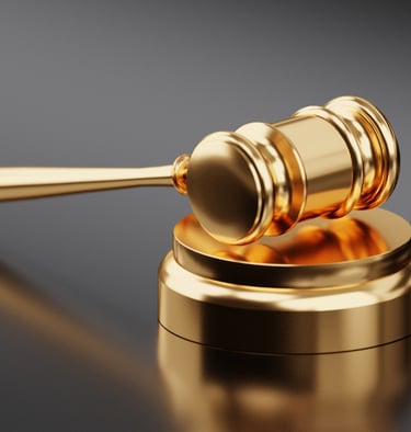 a golden gavel with a gavel and a gavel