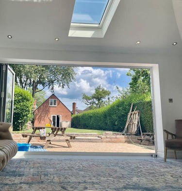 open plan living room with open french doors fitted in droitwich home