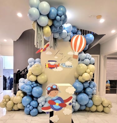 Airplane themed balloon backdrop for two brothers