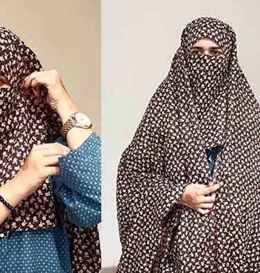 a woman wearing a brown and white chadar and a blue abaya