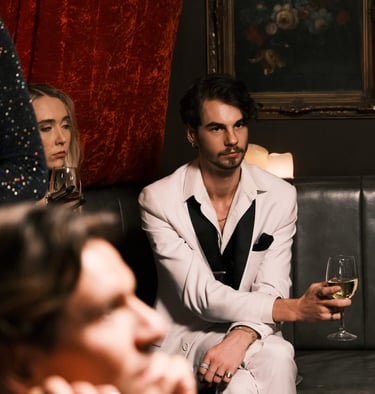 a man and woman sitting on a couch in a room