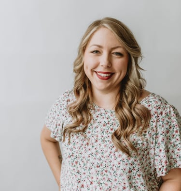 a woman smiling with blonde hair