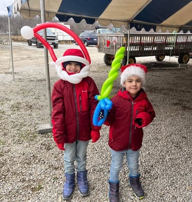 Kids posing with their balloons