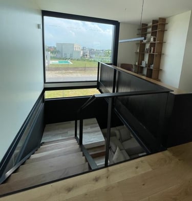 a staircase way with a view of a window