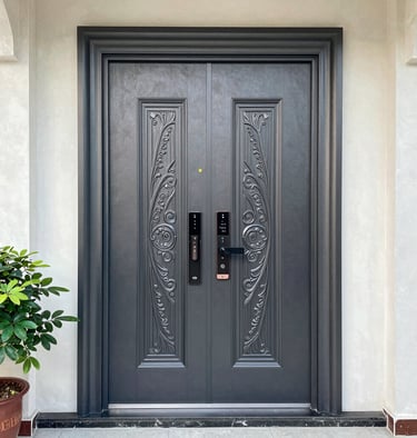 A sleek modern steel door with matte black finish and brushed steel accents, set against a dark luxury backdrop.
