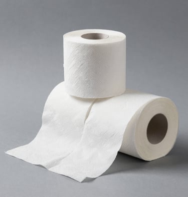 Stack of colorful reusable cleaning cloths rolled neatly on a wooden table