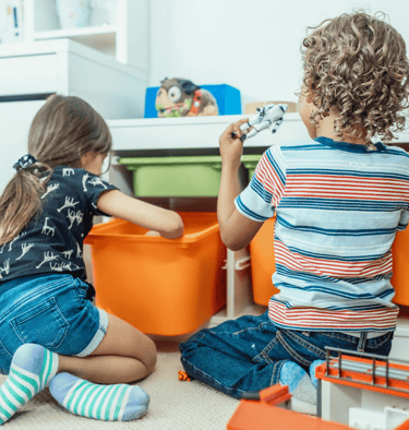 Two children learn through play.