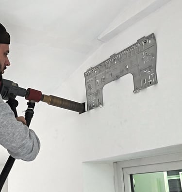 Traversée murale par carottage d'un mur pour unité murale.