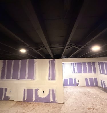 TAPE AND MUD ROOM IN BASEMENT 