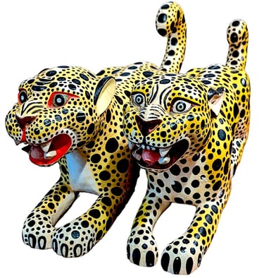 a pair of hand carved Oaxican leopard cubs