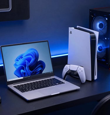 A tablet and a laptop side by side, both showing colorful screens.