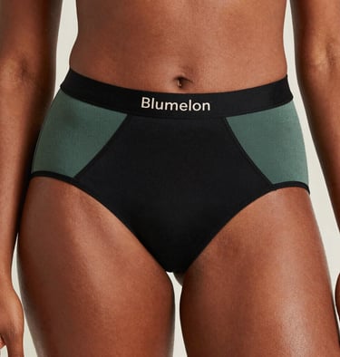 Strong absorbency menstrual underwear displayed with water droplets to emphasize leak protection.
