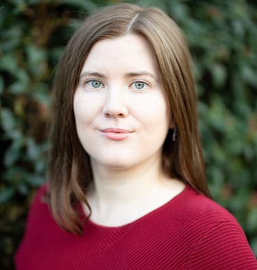 Adept Mediation professional compassionate female mediator looking at a client