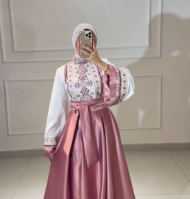 Elegant modest pink satin skirt and white embroidered long-sleeve blouse with a matching hijab.