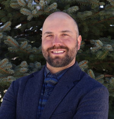 Professional headshot of Elliott Paull owner of Enclave Property Management