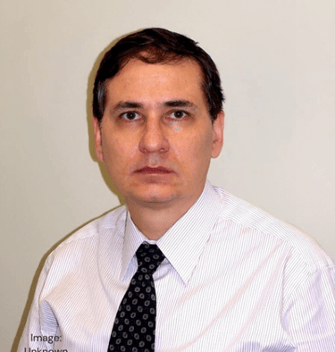 Dr. Cicero Galli Coimbra in tie, neurologist and vitamin D researcher.