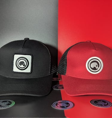 two hats with a camera on a table