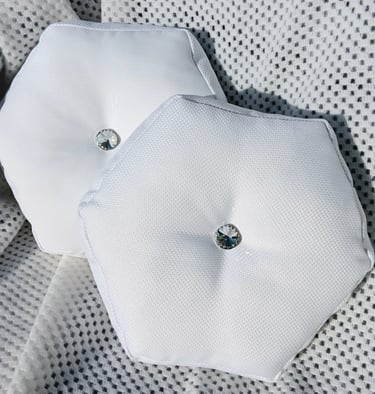A set of luxury hexagonal accent cushions, with diamond like stud in the middle.