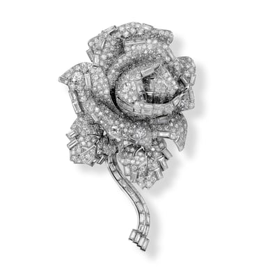 Cartier diamond rose brooch crafted with brilliant and baguette-cut diamonds.