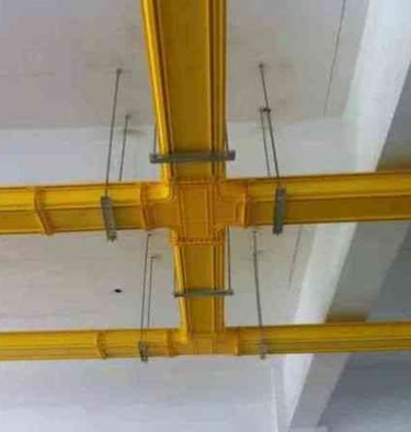 a ceiling with a yellow fiber cable tray systems
