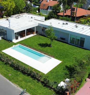a house with a pool and a swimming pool