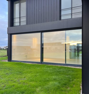 a large house with a large glass window