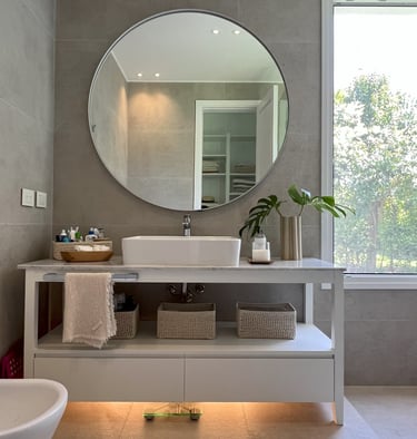 a bathroom with a large mirror and a sink