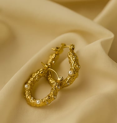 a pair of gold earrings with pearls and pearls, gold