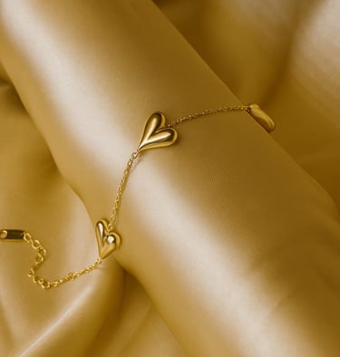 a gold bracelet bracelet bracelet bracelets with a heart shaped leaf