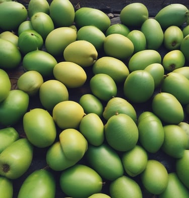 Fresh lemon pickles resting in a clay pot, glistening with oil and spices.