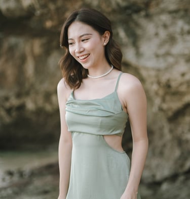 Portrait of woman in green dress during photoshoot at Geger Beach Nusa Dua Bali