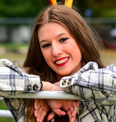 Girl shoulder/head shot shown leaning on bar