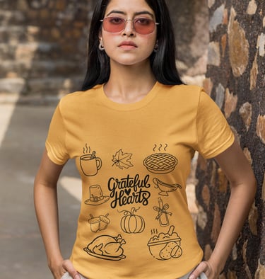 a woman wearing a yellow shirt with a graphic of a woman with a hat and