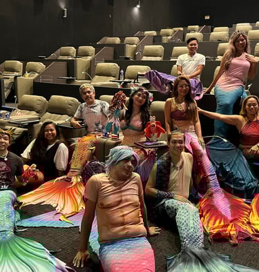 mermaids celebrating together in a cinema