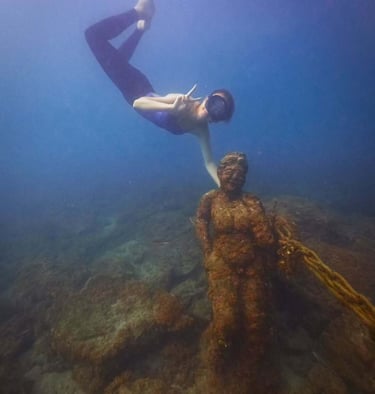 Helena visiting one of the famous underwater statues in Jeju