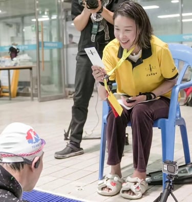 Helena participating as judge in a freediving competition with AIDA