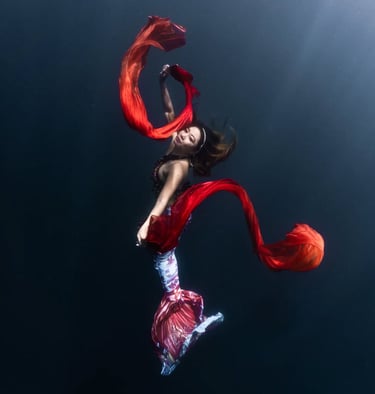 Amarie in a spectacular underwater shot with silk veils in the ocean