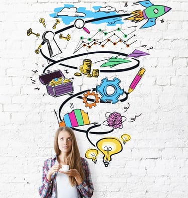 A woman holding a cup of coffee stands in front of a white brick wall with colorful doodles, including a rocket and gears