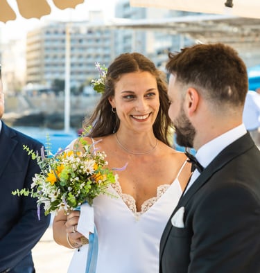 seaside wedding photoshoot, couple looking at eachother, seaside Malta