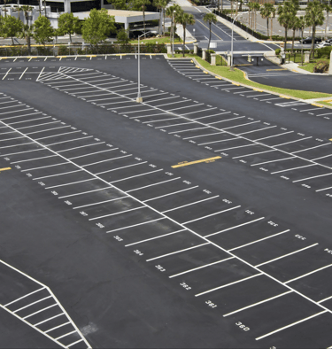 an empty newly striped parking lot