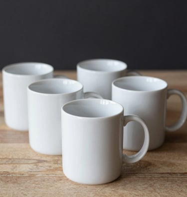 A colorful display of custom printed mugs arranged neatly on shelves.