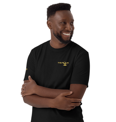 man wearing the pour shop logo black t shirt portrait