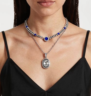 woman in green coat wearing silver necklace