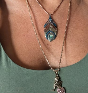 Pictured: peacock and mermaid necklace, layered 