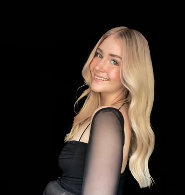 Nicole fine line tattoo artist creating elegant feminine tattoos at Aura Tattoo Studios