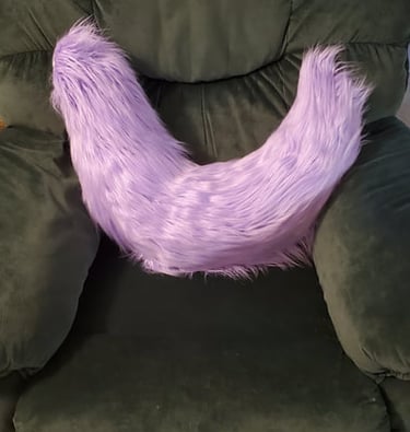 A fluffy purple tail made by Teto Creations