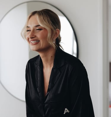 a woman in a black shirt laughing