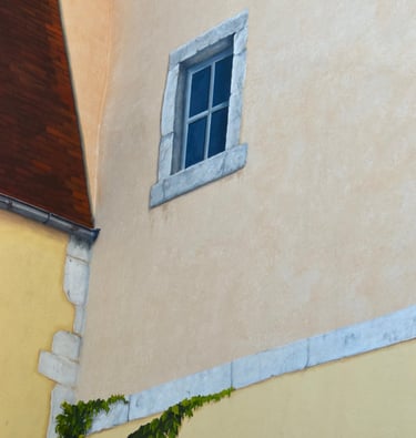 Détails de trompe-l'oeil peint sur des façades, une fausse lucarne, fausses pierres, faux toit.