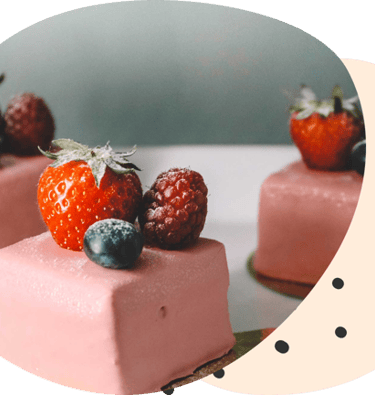 a  gourmet marshmallow dessert with triple berry chocolate topped with berries on a white background