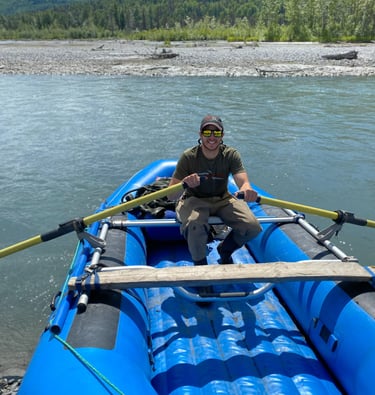 Man on Raft in Alaska on a River